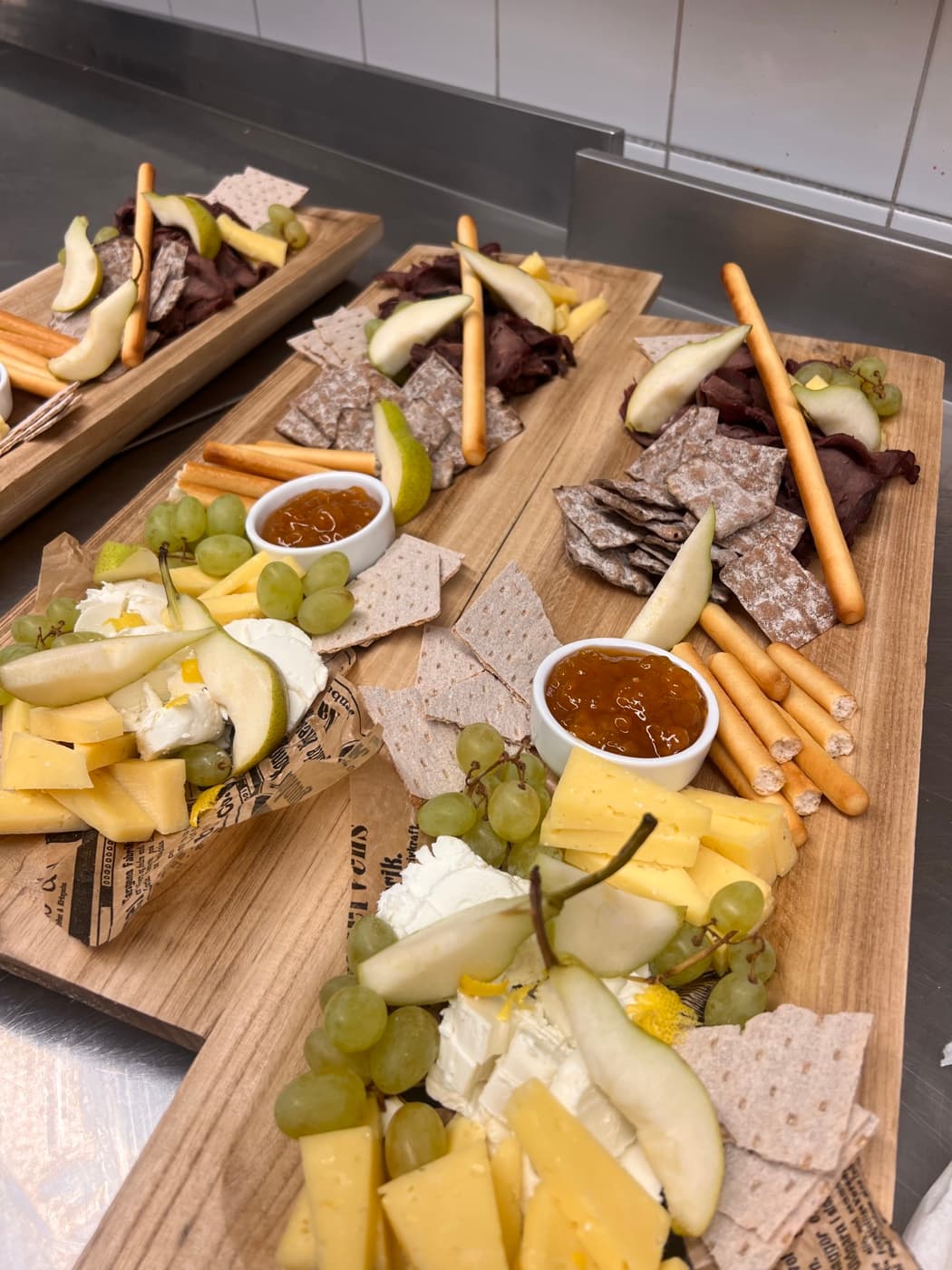 Traditional cheese and charcuterie board with dried reindeer meat and flatbread