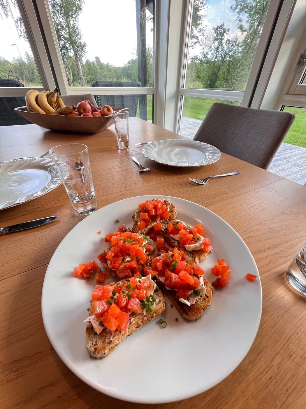 Reindeer crostini with lingonberry, pear and melted cheese